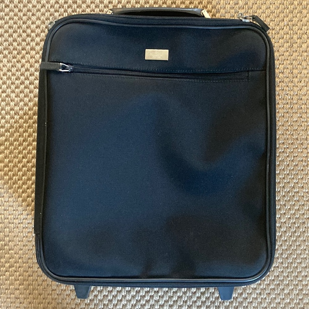 Gucci Rolling Carry On Suitcase with adjustable handle.